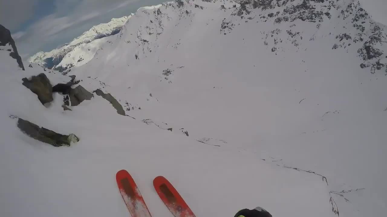 Person Stops Themselves From Falling Off Of Cliff While Skiing