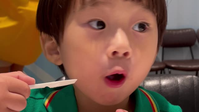 A boy eating ice cream