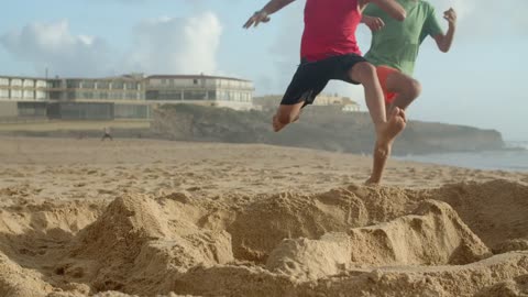 boys playing in tha beach