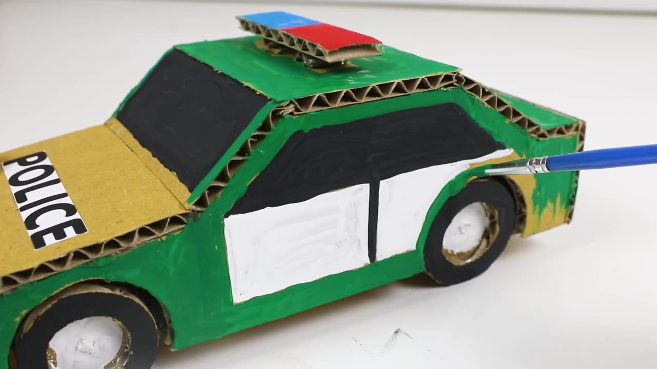 The steps of making and painting a police car with cardboard