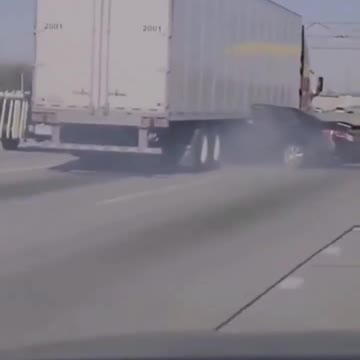 Driver desperately waves for help as a semi-truck dragged her car sideways along a Chicago highway