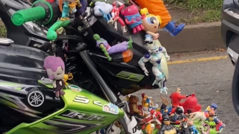 Man's Motorbike Covered In Toys