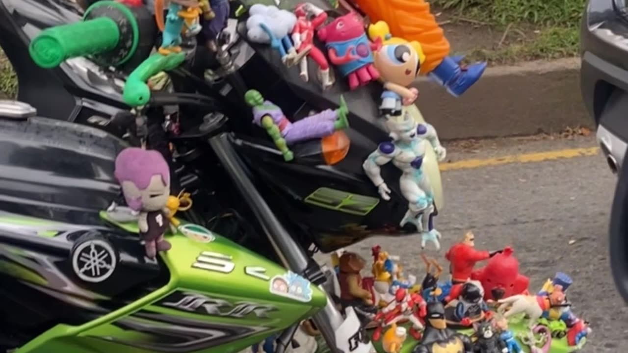 Man's Motorbike Covered In Toys