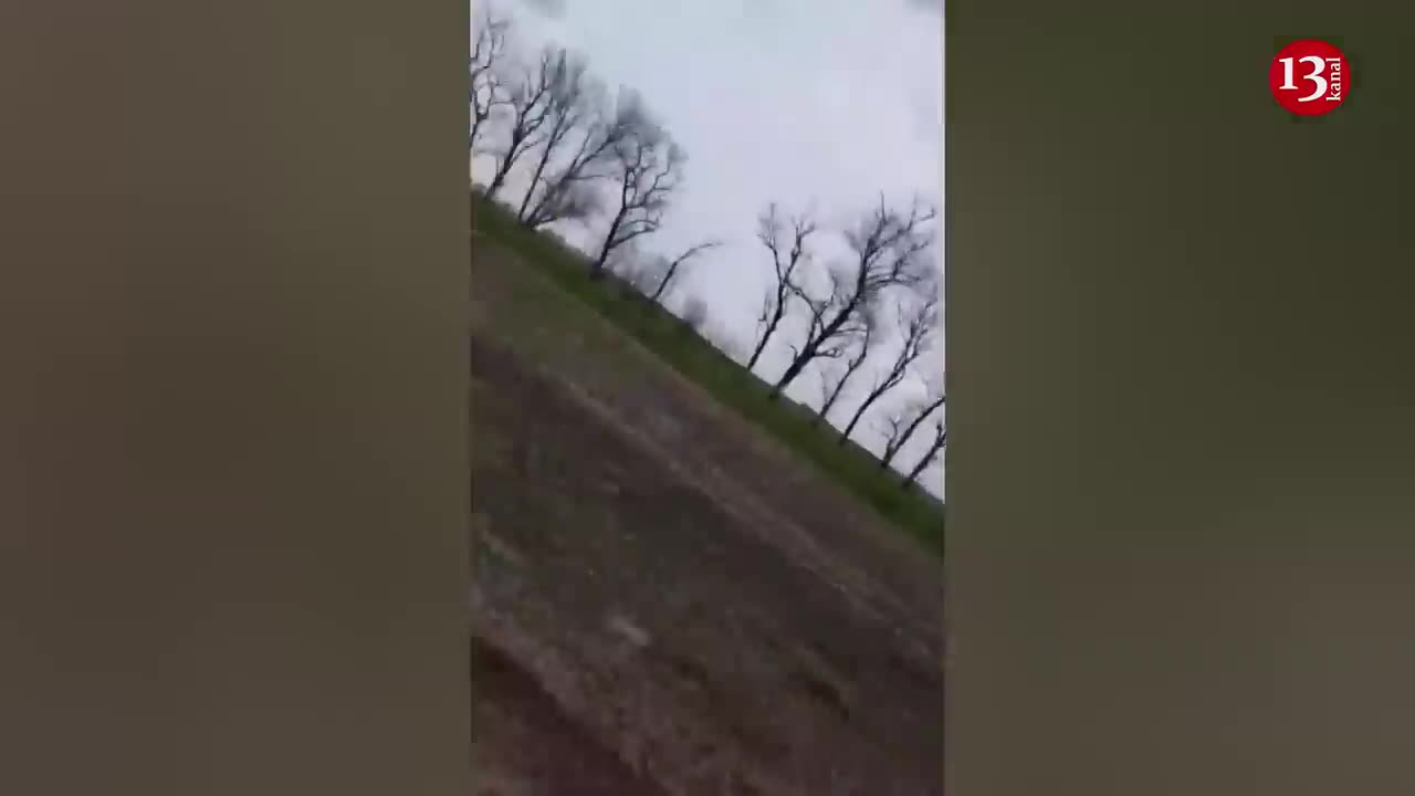 Ukrainian soldiers trying to carry their wounded fellow soldiers away from the battlefield