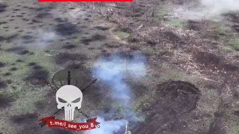 Russian fighters under cover of a tank
