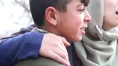 Palestine Mother and her son crying, house, demolished, Israeli forces in Hebron, Palestine