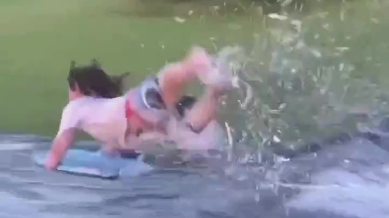 Little person on a slip and slide. What can go wrong?