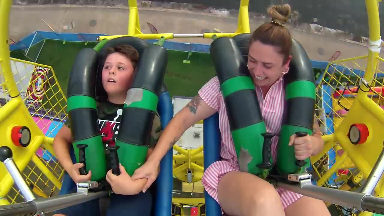 Kid passes out on Sling Shot Ride. More than once.