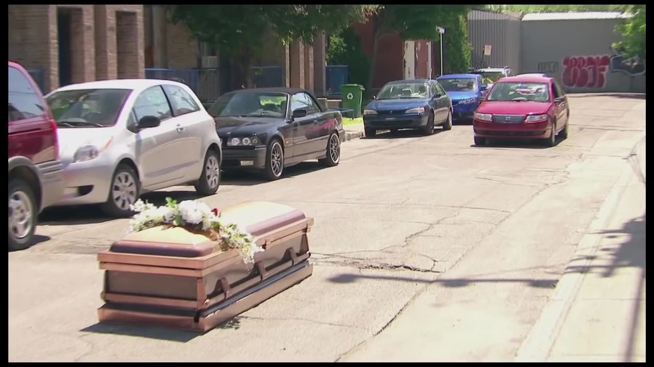 Coffin Blocks Cars from Driving By