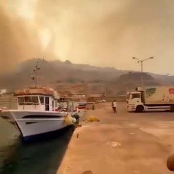 Rhodes, Greece is currently witnessing a dramatic and chaotic scene.