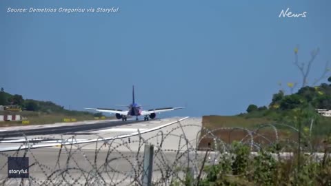 Jet lands dangerously close to plane spotters, scaring onlookers