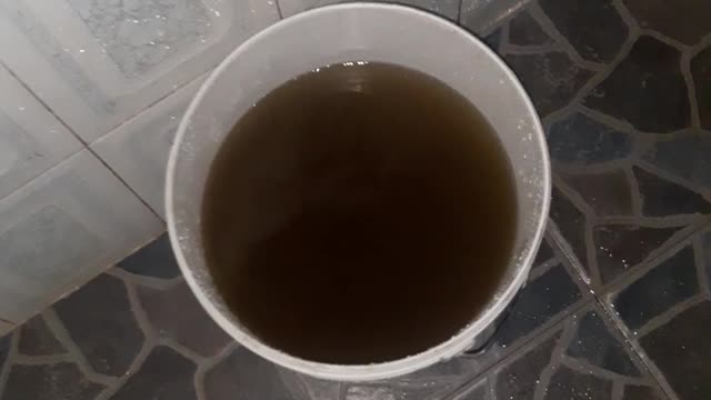 Flowing Pipe water that looks like coffee or Lipton