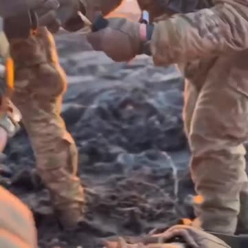 A grenade explodes a few meters from a Ukrainian soldier