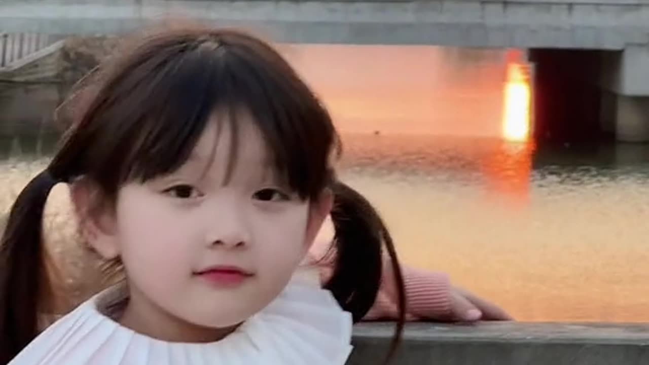 baby welcomes the sunset