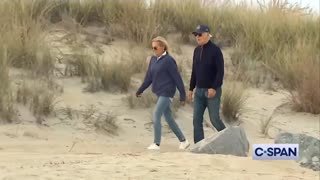 Biden struggling with sand on the beach in North Dakota