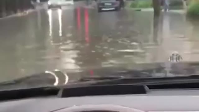 Heavy Rain Floods Car