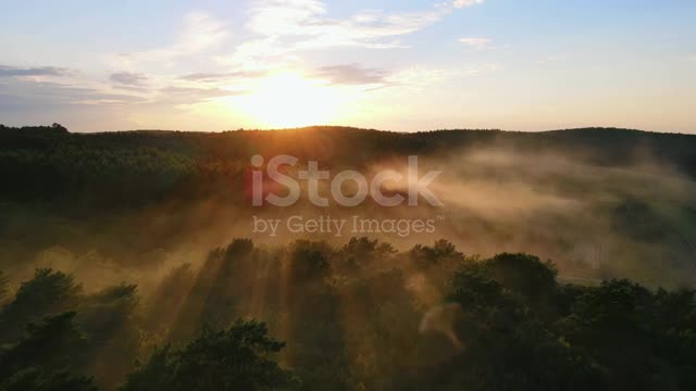 Fabulous sunset from a bird's eye view. Fog illuminated by the sun.