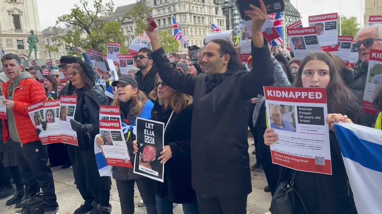 Supporters of Israel gather peacefully on Parliament Square singing God Save the King.