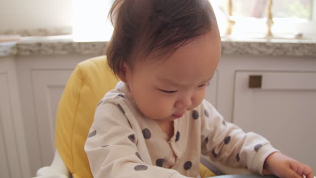 High Chair Playing with Chopped Fruits