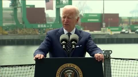 The Slanderer and Thief Speaks with Evergreen Shipping Containers on the green screen behind him.