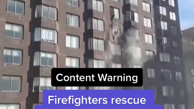 Firefighters rescue woman dangling from 20th-story window