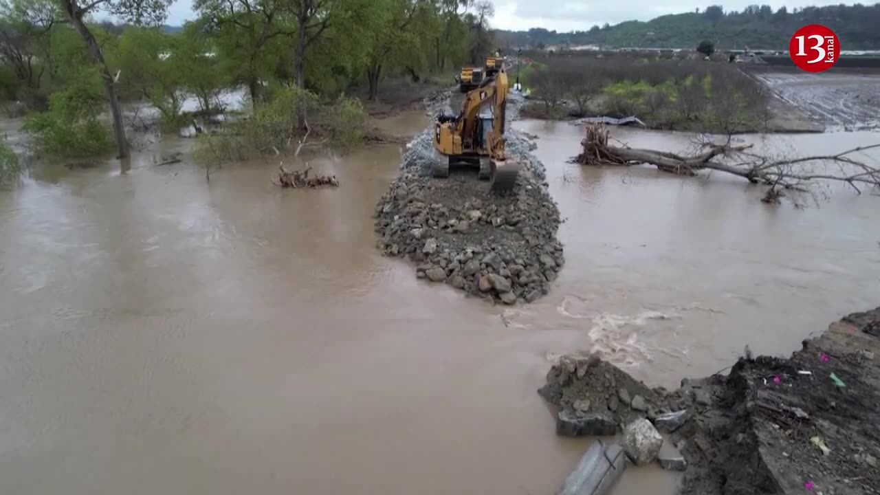 Crews race to repair broken levee in flood-soaked California