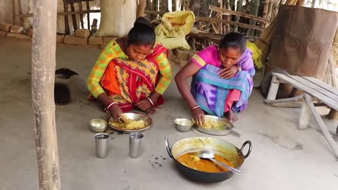 Santali tribe woman in Bangladesh cooking food