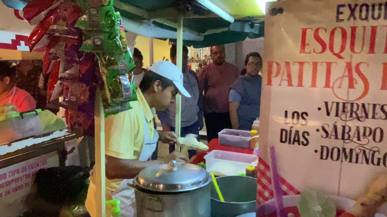 Speedy street buttered corn vendor in Oaxaca, Mexico.