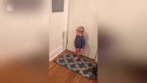 Little boy sees his shadow for the first time!