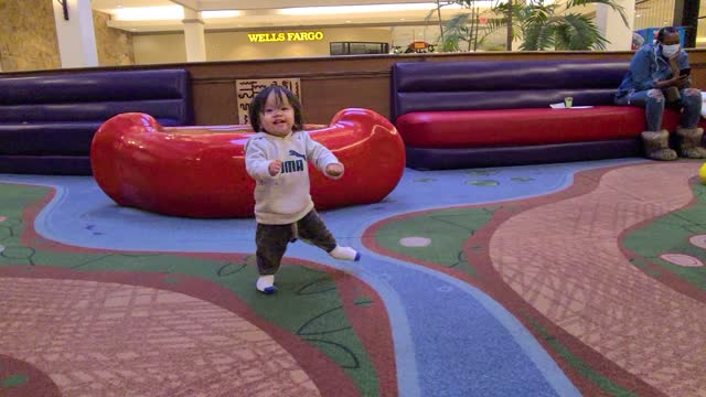 Perfecting the zombie walk at the indoor playground