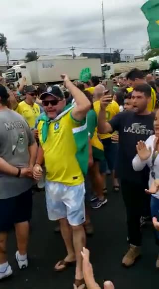 Mirassol, Brazil: Car hits multiple civilians with Brasil flags blocking road