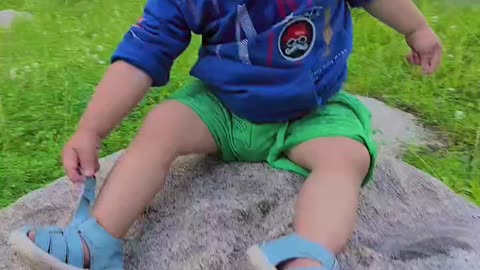 A cute kid is playing in nature ,cute videos