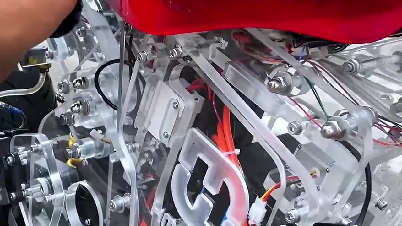 The motorbike is all acrylic from the engine cover to the acrylic body