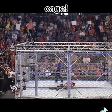 Eddie Guerrero top of cage