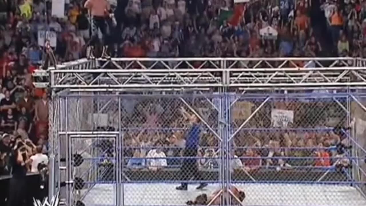 Eddie Guerrero top of cage