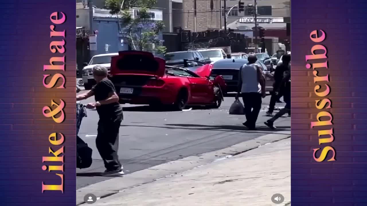 A vehicle involved in a car crash in Los Angeles gets looted on the street.