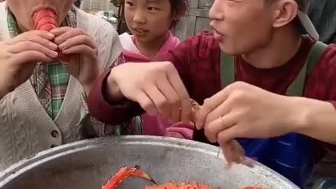 Jat Lee eating seafood