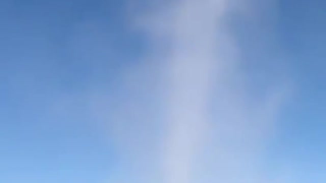 Dust devil tears up sand around mesmerized onlooker