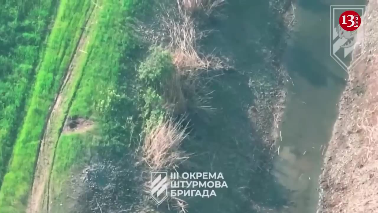 Drone pursues weary Russians dragging their wounded fellow soldiers and drinking water from a pond