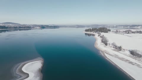 Outdoor aerial photography takes you into a rural American town in the snow