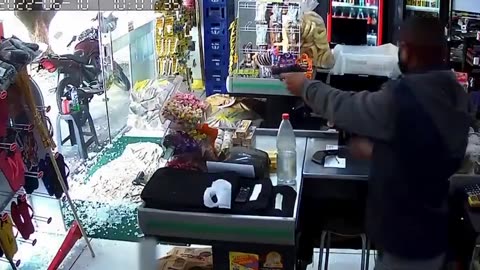 Armed robber surprised when store owner shoots him protecting his business.