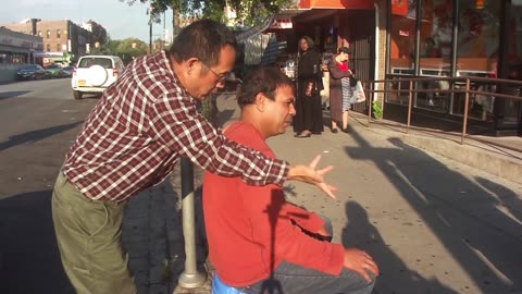 Luodong Massages Mexican Man On Sidewalk