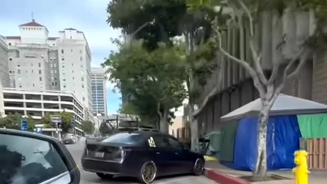 Welcome to San Diego. Make yourself at home with a tent on the street.