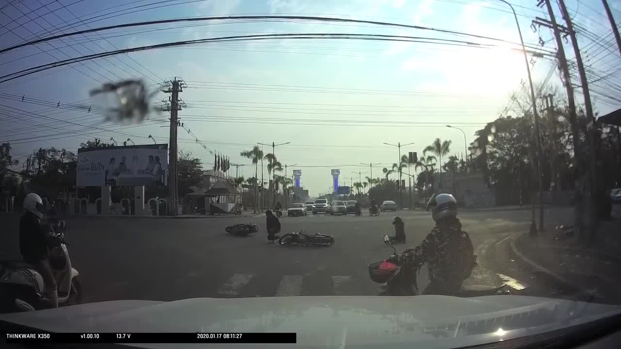 Two Motorbikes Crashing Into Each Other After A Guy Ignored The Red Light