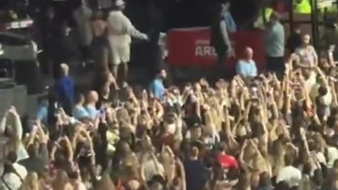Travis cuddles Taylor Swift as she leaves The Eras Tour show
