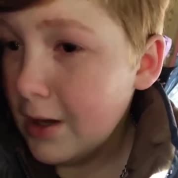 A young Ukrainian Orthodox parishioner is in tears because the church