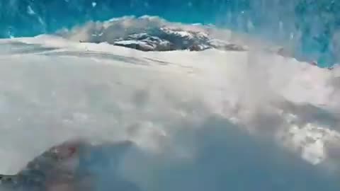 Watch as a skier falls into a glacier 😳