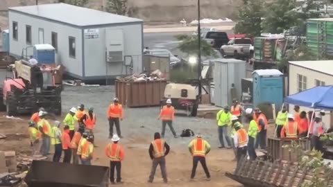 Circle of construction workers does warm ups 😲