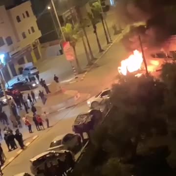 Several Palestinians threw stones at an Israeli military vehicle in Beita