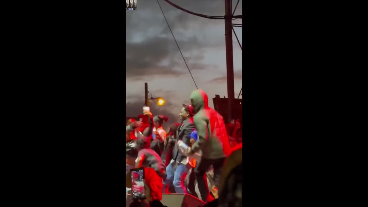 Kendrick dances with kids while performing Squabble Up